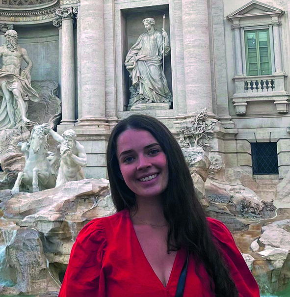 Freya standing in front of Trevi Fountain